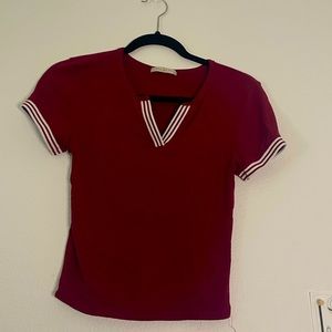 Size: Small, Petite. White stripes on side and down the chest area.